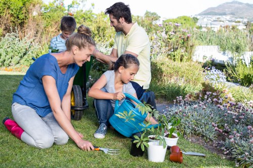 Electric low-emission gardening van parked near residential green space